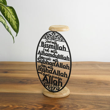 Siyah oval metal zikir mumluğu, mumsuz, ahşap tabla ve taban detayıyla
